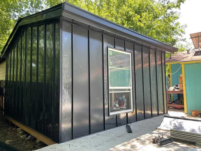 Black standing seam metal wall panels for Roof Inspection in Mocksville